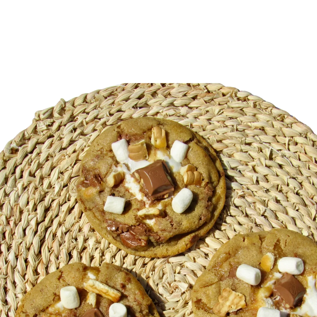 Three s'mores cookies on a woven placemat