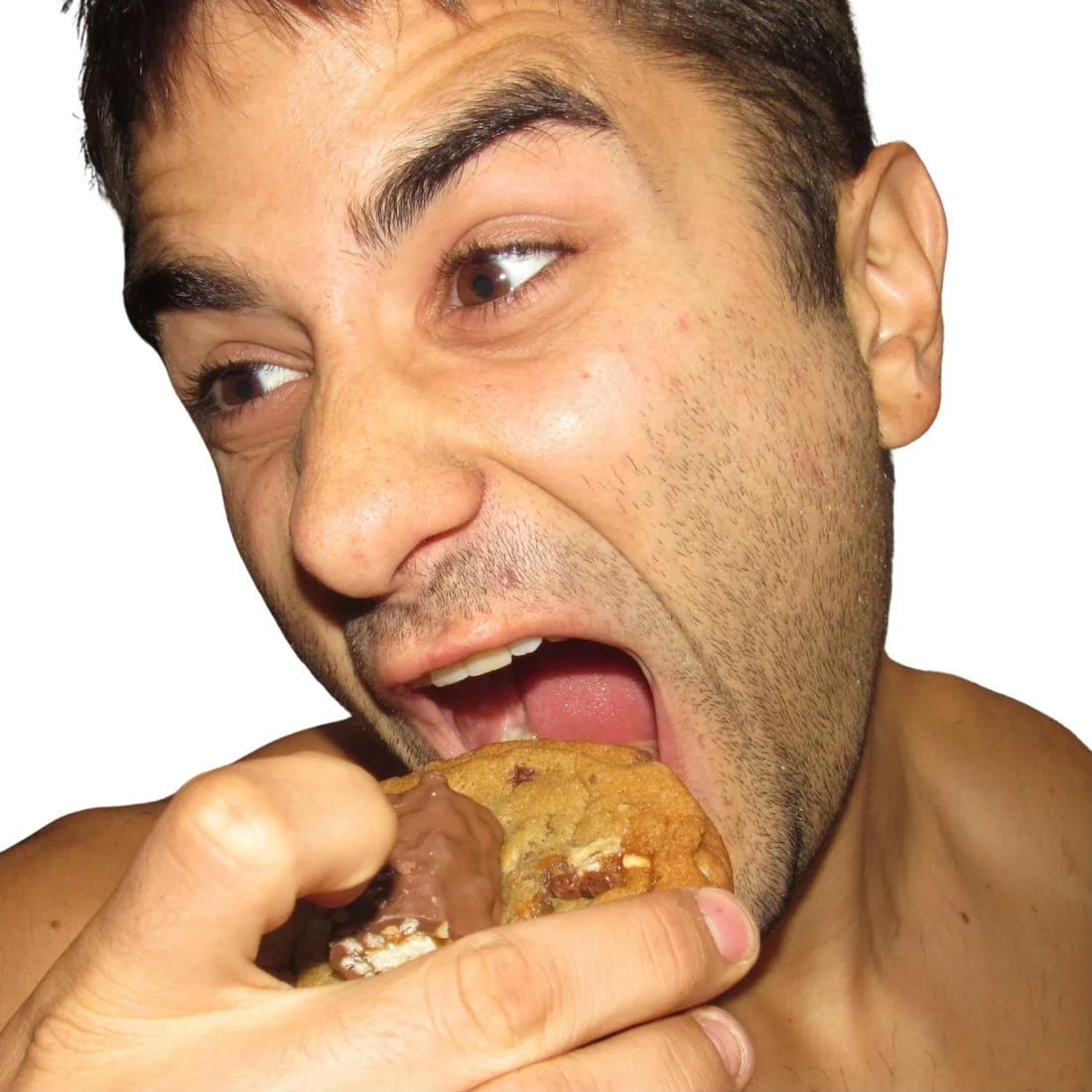 Peter taking a big bite of a cookie